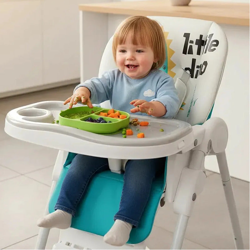 Silla Comedor Kidshop Doble Bandeja Plegable Dinosaurio Turquesa